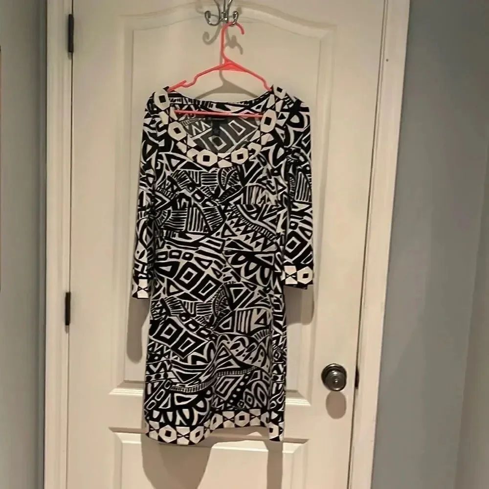 Exotic looking dress by I NC. Size M